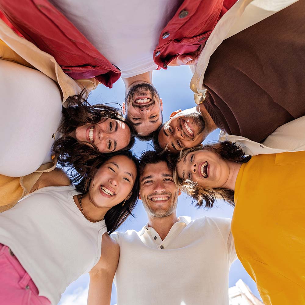 happy group of young people in circle XVGXNXH - ReWild UrSelf